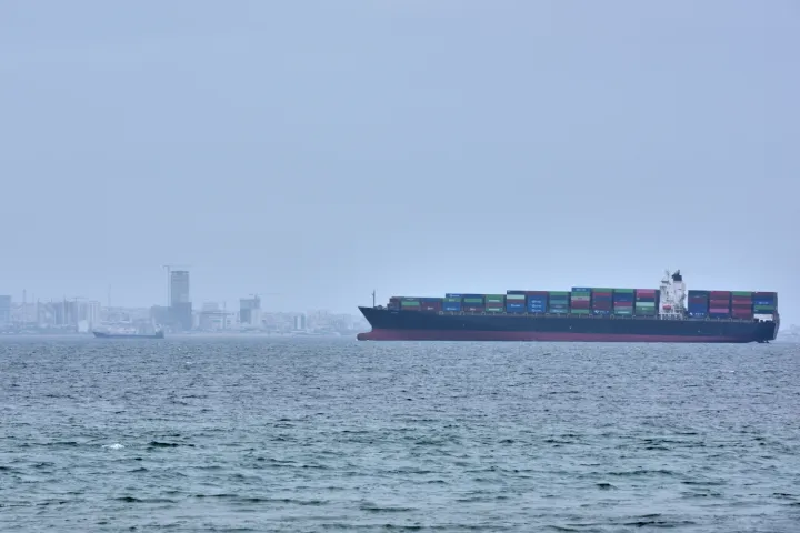A container ship is seen in the Strait of Hormuz off the coast of Qeshm Island
