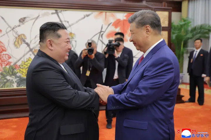 AP In this photo provided by the North Korean government, North Korean leader Kim Jong Un, left, shakes hands with Chinese President Xi Jinping