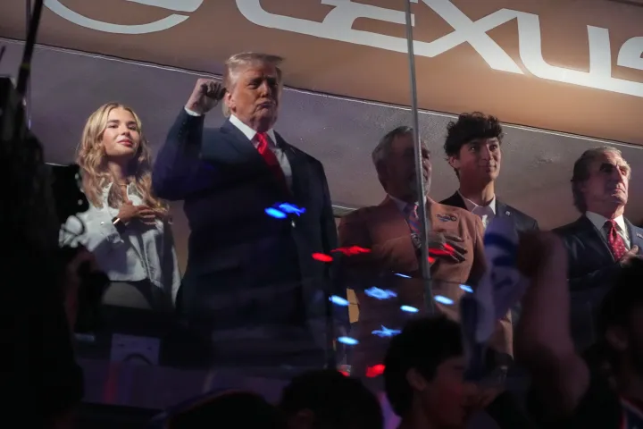 AP President Donald Trump gestures during the National Anthem