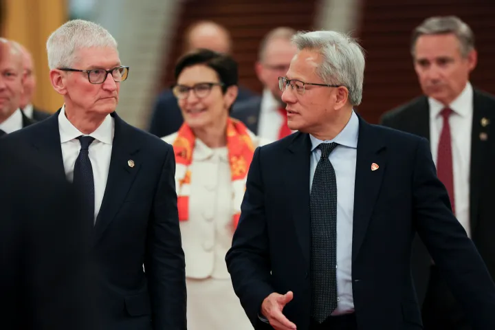 Nvidia CEO Jensen Huang, front right, and Apple CEO Tim Cook, left