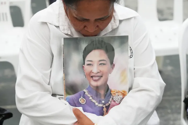 A person holds a picture of the late Thailand Princess Bajrakitiyabha Mahidol in Bangkok