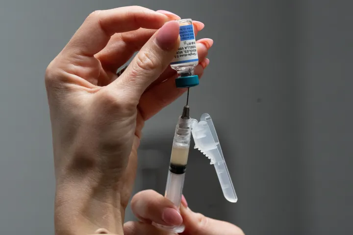 Lauren Ellenburg, a nurse, prepares a combination measle