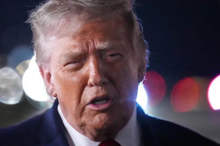 AP President Donald Trump talks with reporters