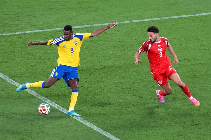 AP Sweden's Alexander Isak (9) shoots and scores their second goal against Tunisia's Montassar Talbi