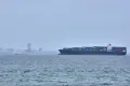 A container ship is seen in the Strait of Hormuz off the coast of Qeshm Island