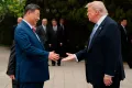 U.S. President Donald Trump, right, shakes hands with Chinese President Xi Jinping 